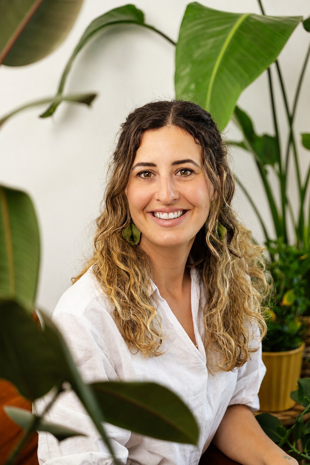 Beatrice Favalli smiling, surrounded by plants