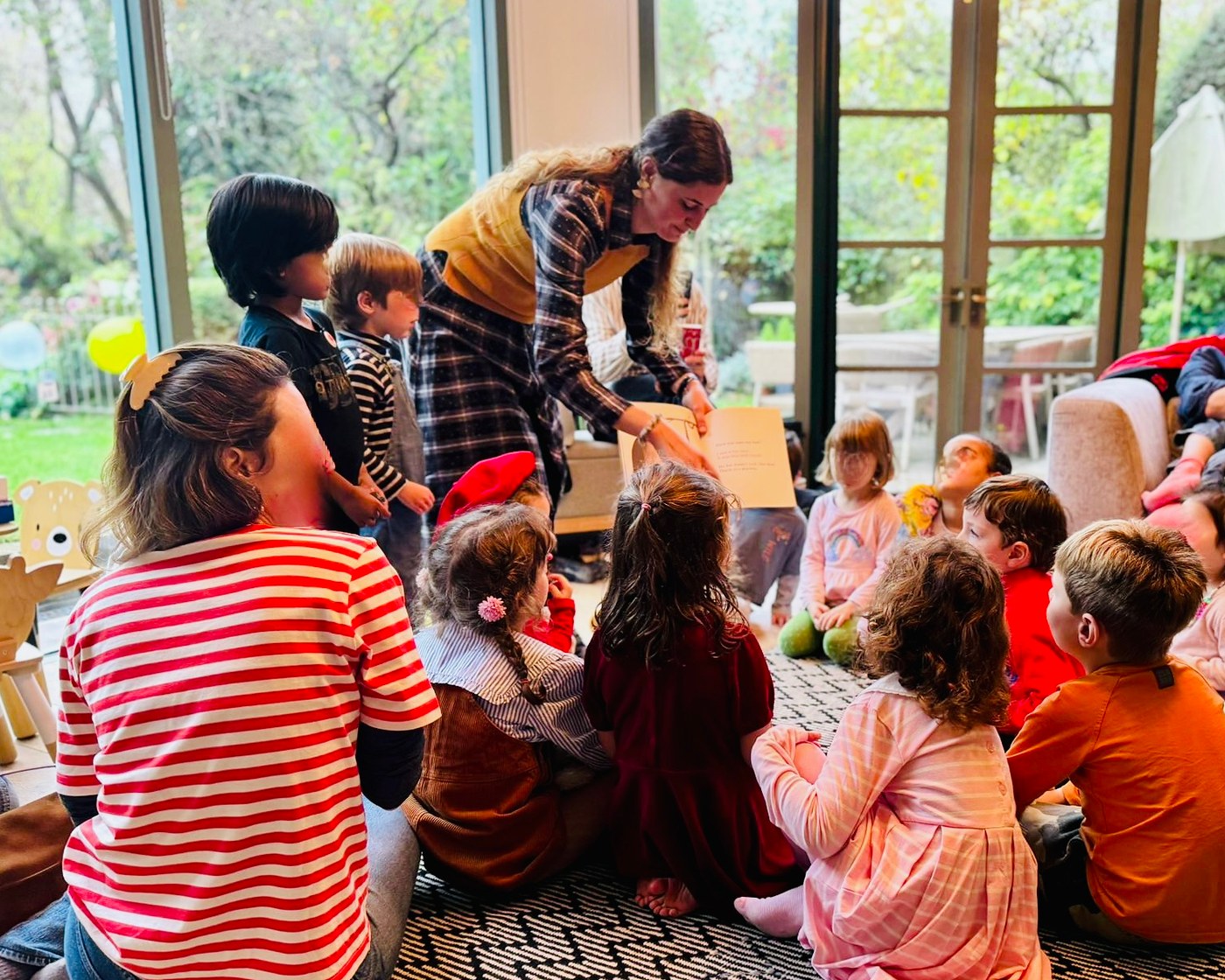 Beatrice reading a story to a group of children